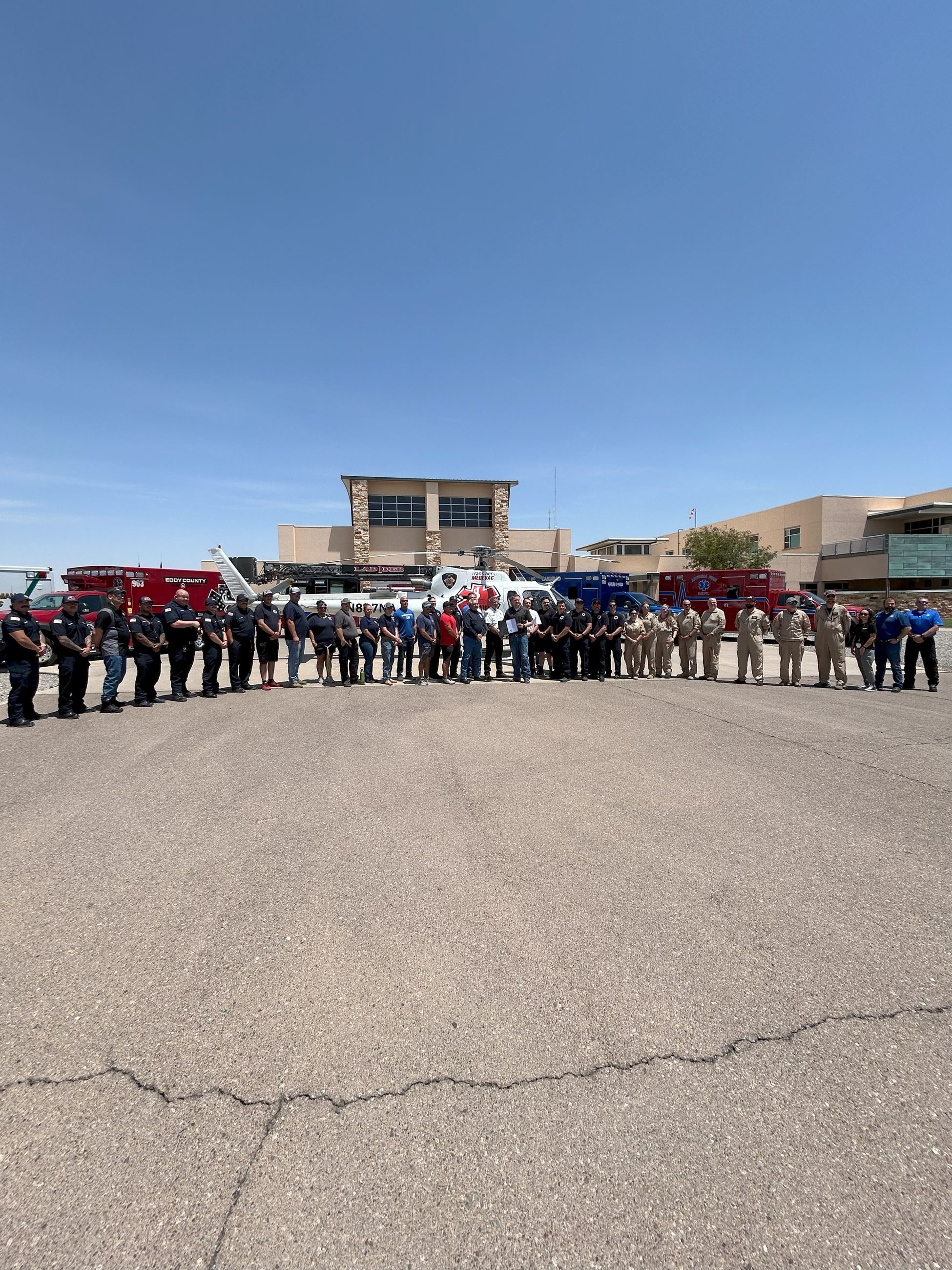Mayor Henry standing with local EMS personnel for the signing of a proclamation